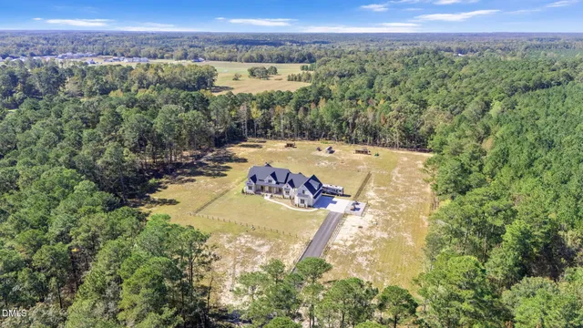 a view of a lake with table and chairs