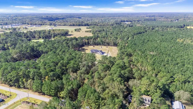 a view of a swimming pool with sitting area