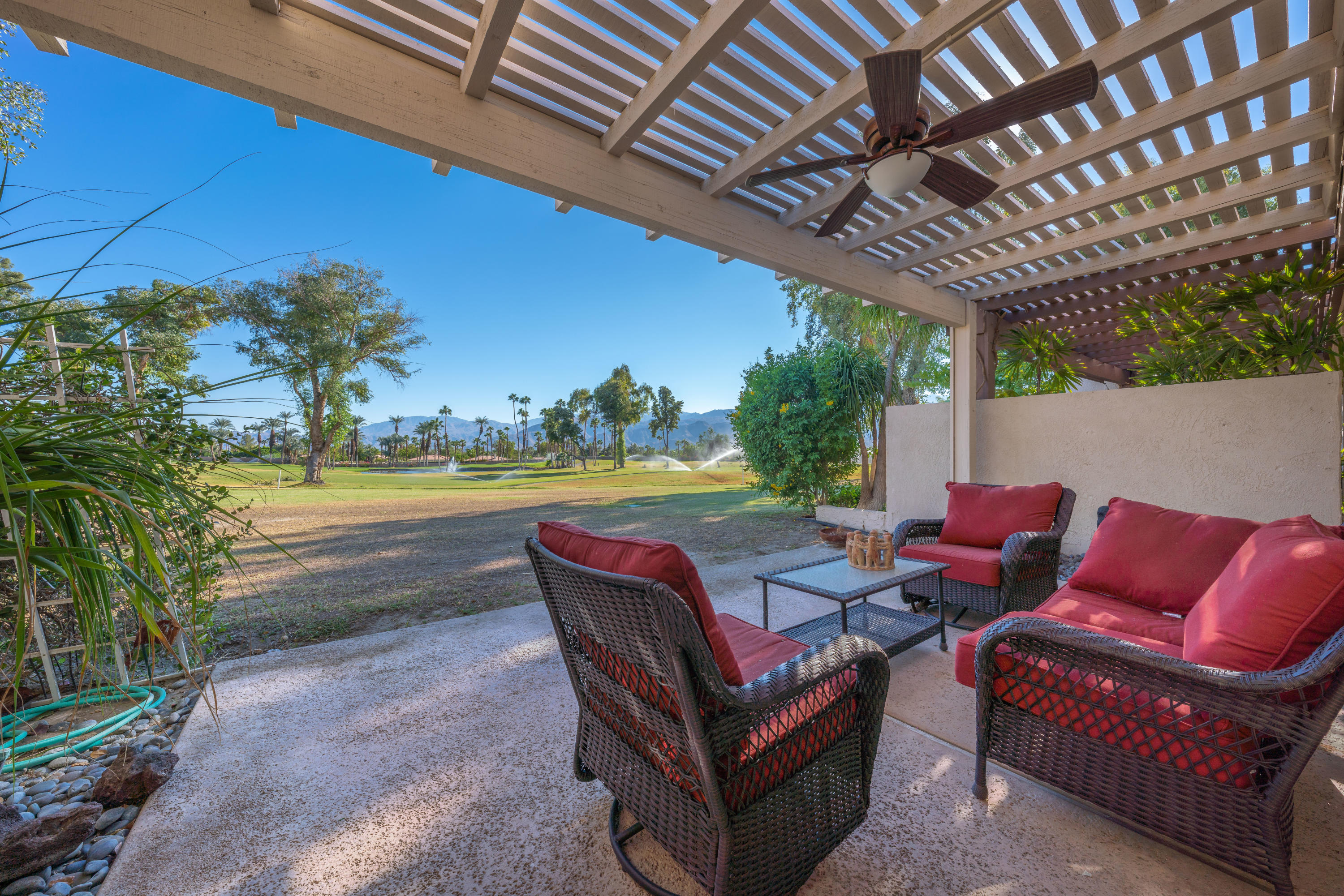 825 Inverness Drive Rancho Mirage, CA 92270 - Photo 1 of 34 a outdoor living space with furniture and a garden