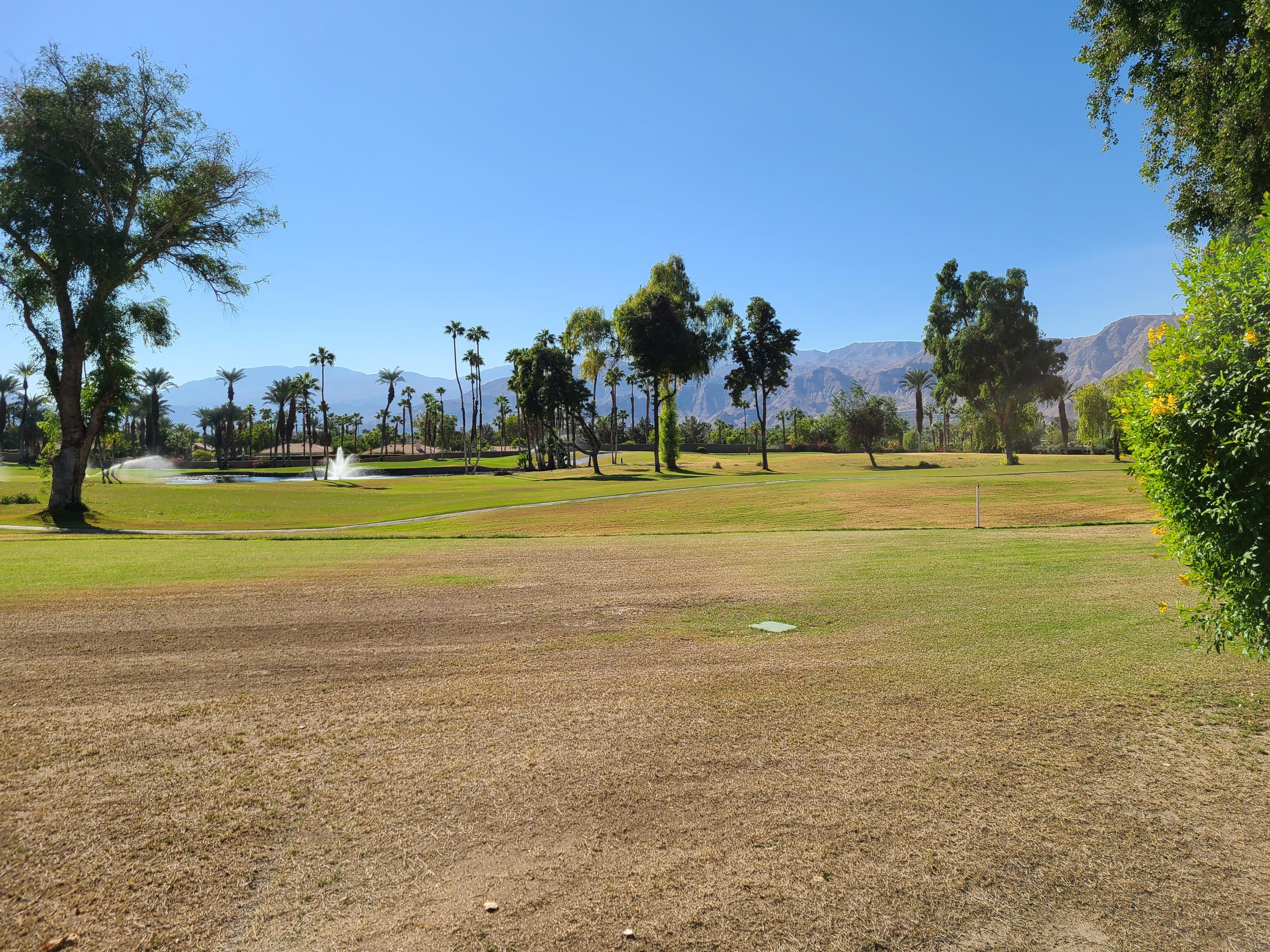 825 Inverness Drive Rancho Mirage, CA 92270 - Photo 2 of 34 a view of an ocean with a houses