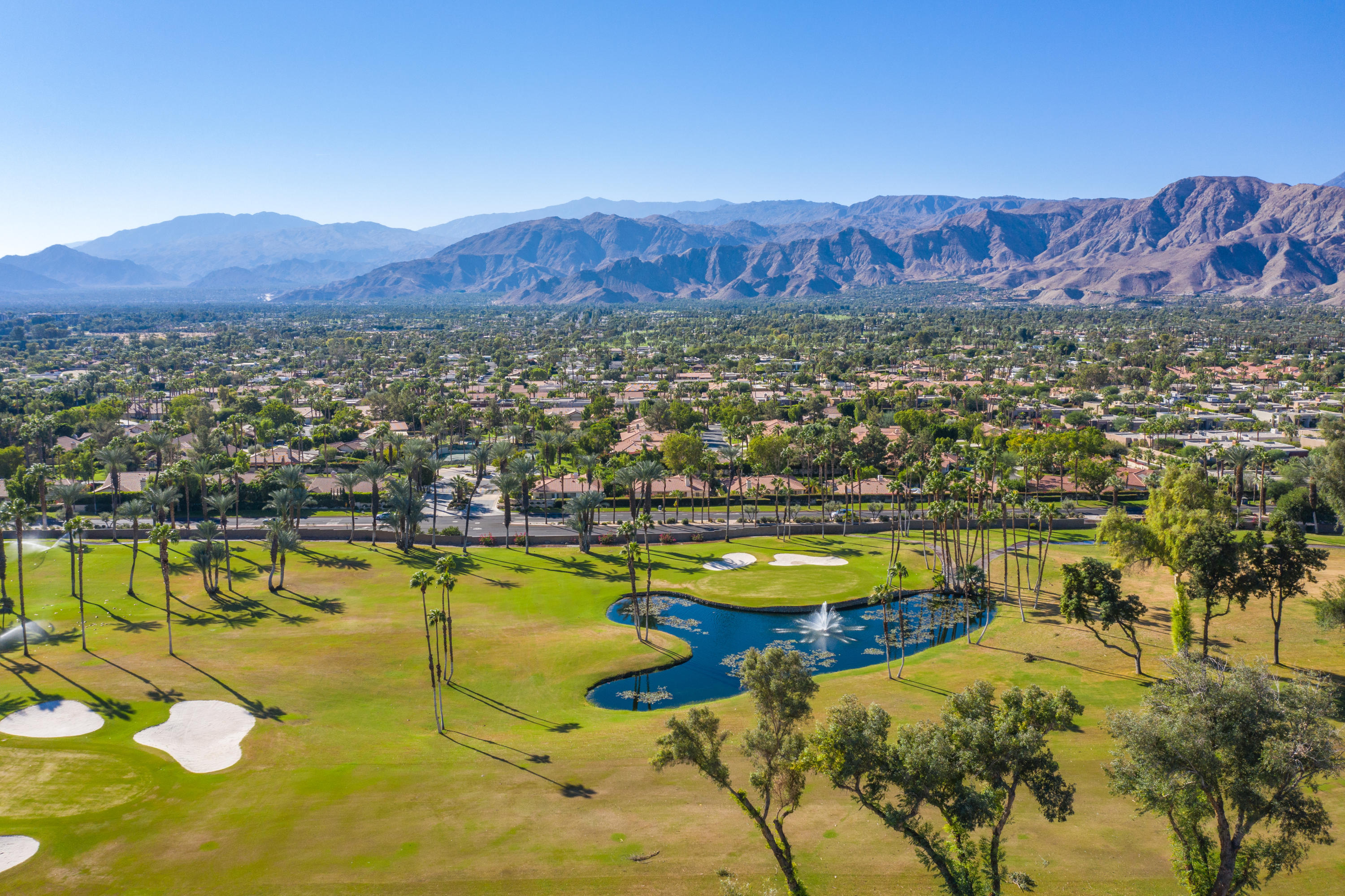 825 Inverness Drive Rancho Mirage, CA 92270 - Photo 17 of 34 a view of a lake with mountains in the background