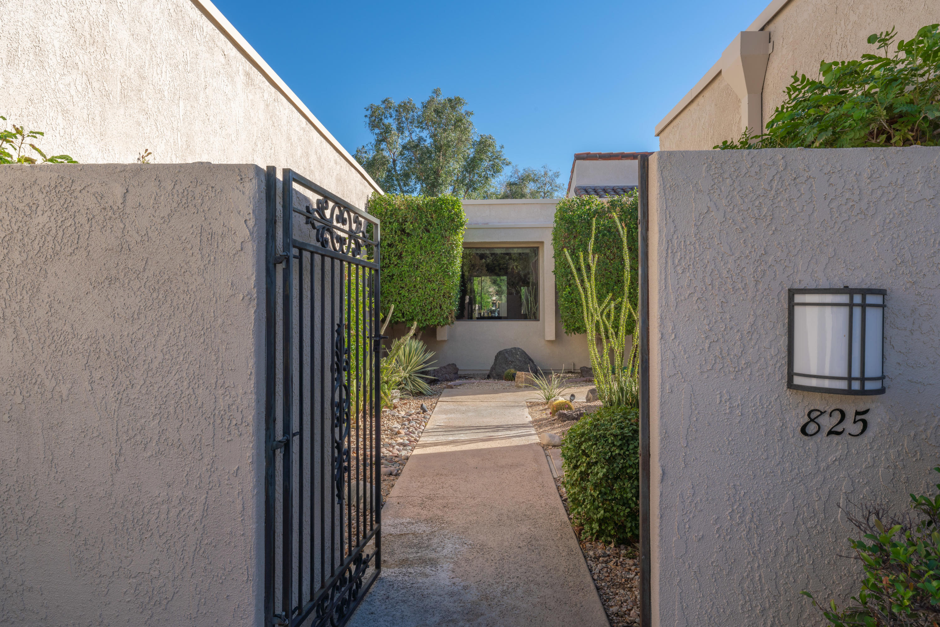 825 Inverness Drive Rancho Mirage, CA 92270 - Photo 3 of 34 a view of a path along with potted plants
