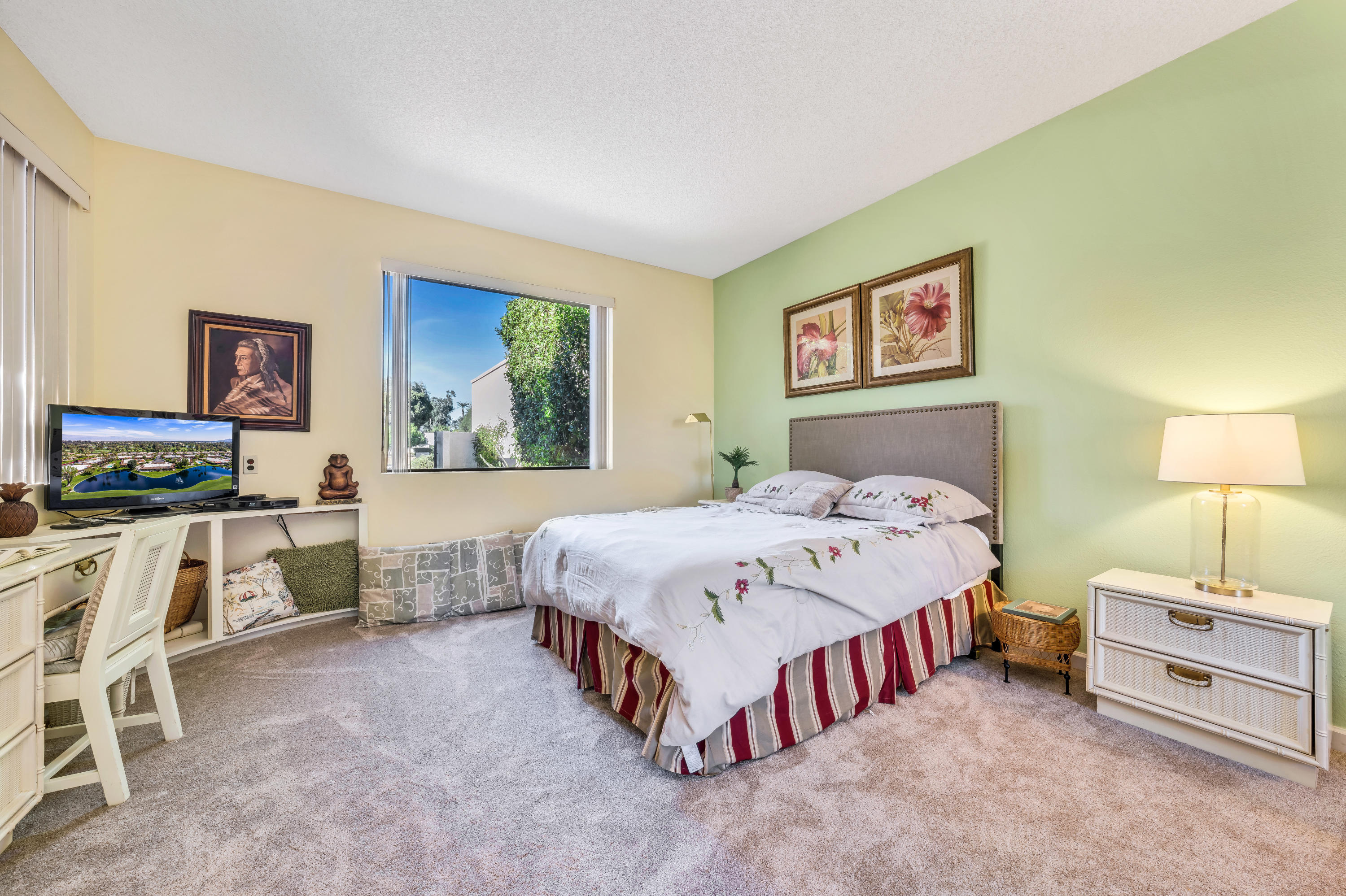 825 Inverness Drive Rancho Mirage, CA 92270 - Photo 22 of 34 a bedroom with a bed and a table in it