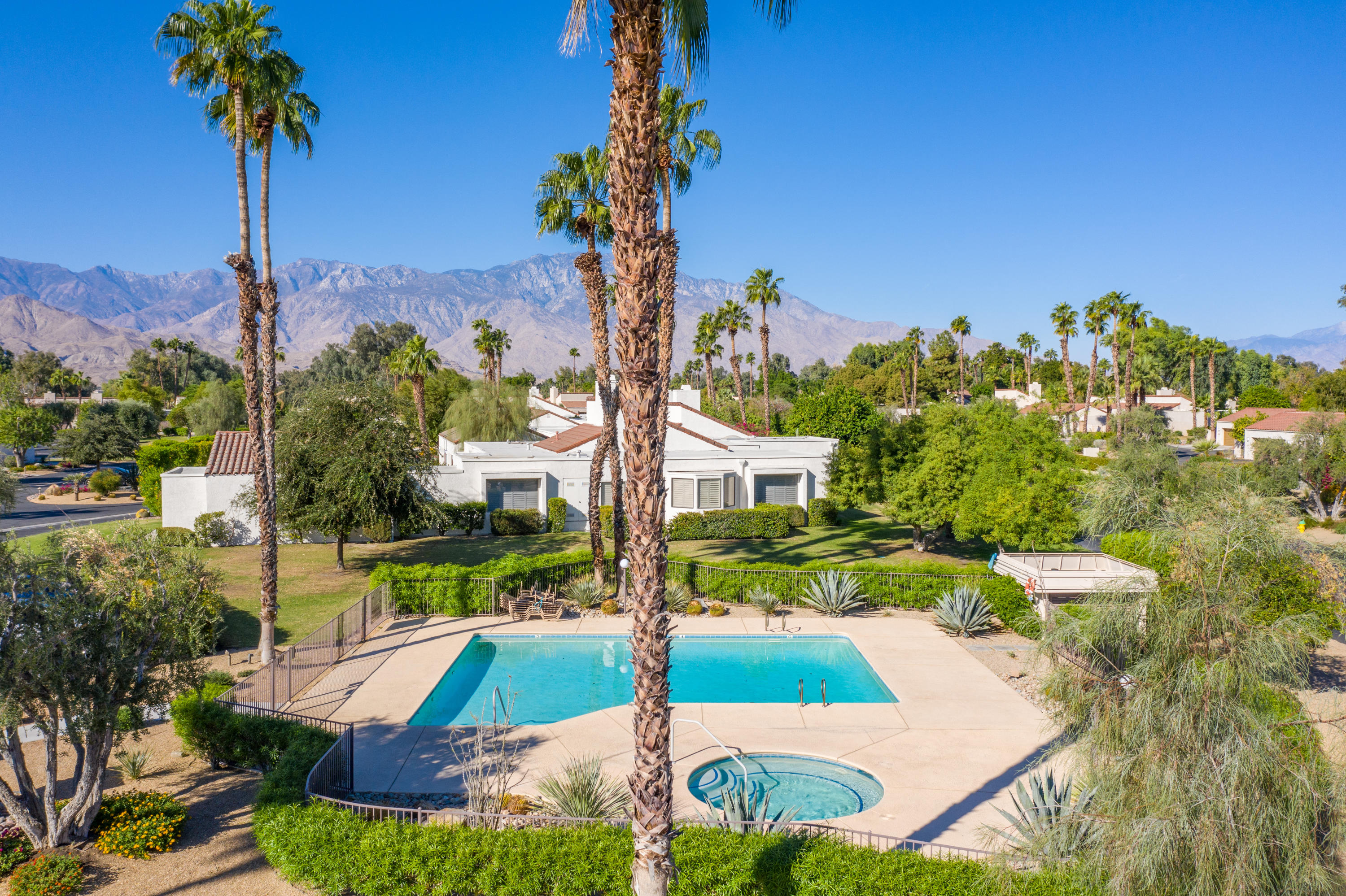 825 Inverness Drive Rancho Mirage, CA 92270 - Photo 26 of 34 a view of a house with a yard and potted plants
