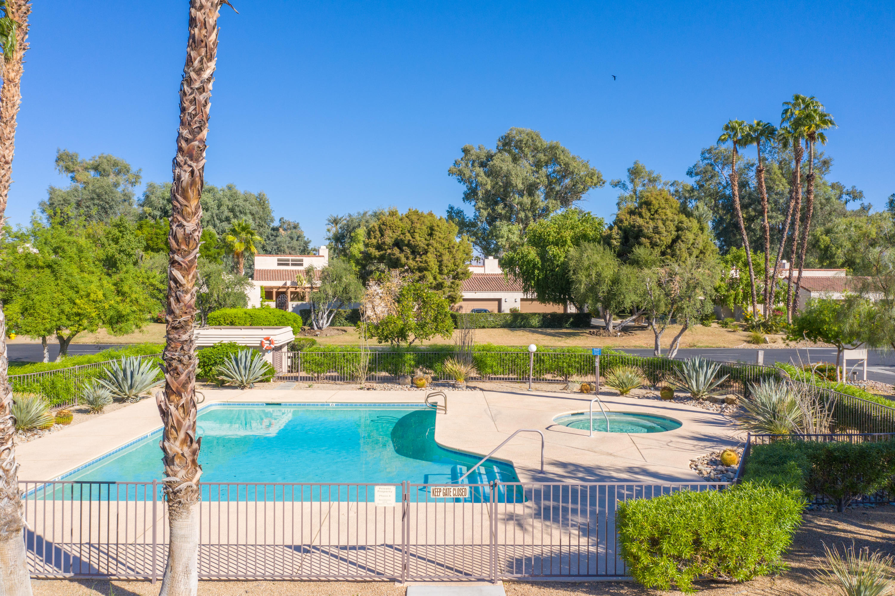 825 Inverness Drive Rancho Mirage, CA 92270 - Photo 28 of 34 a view of a swimming pool with a patio
