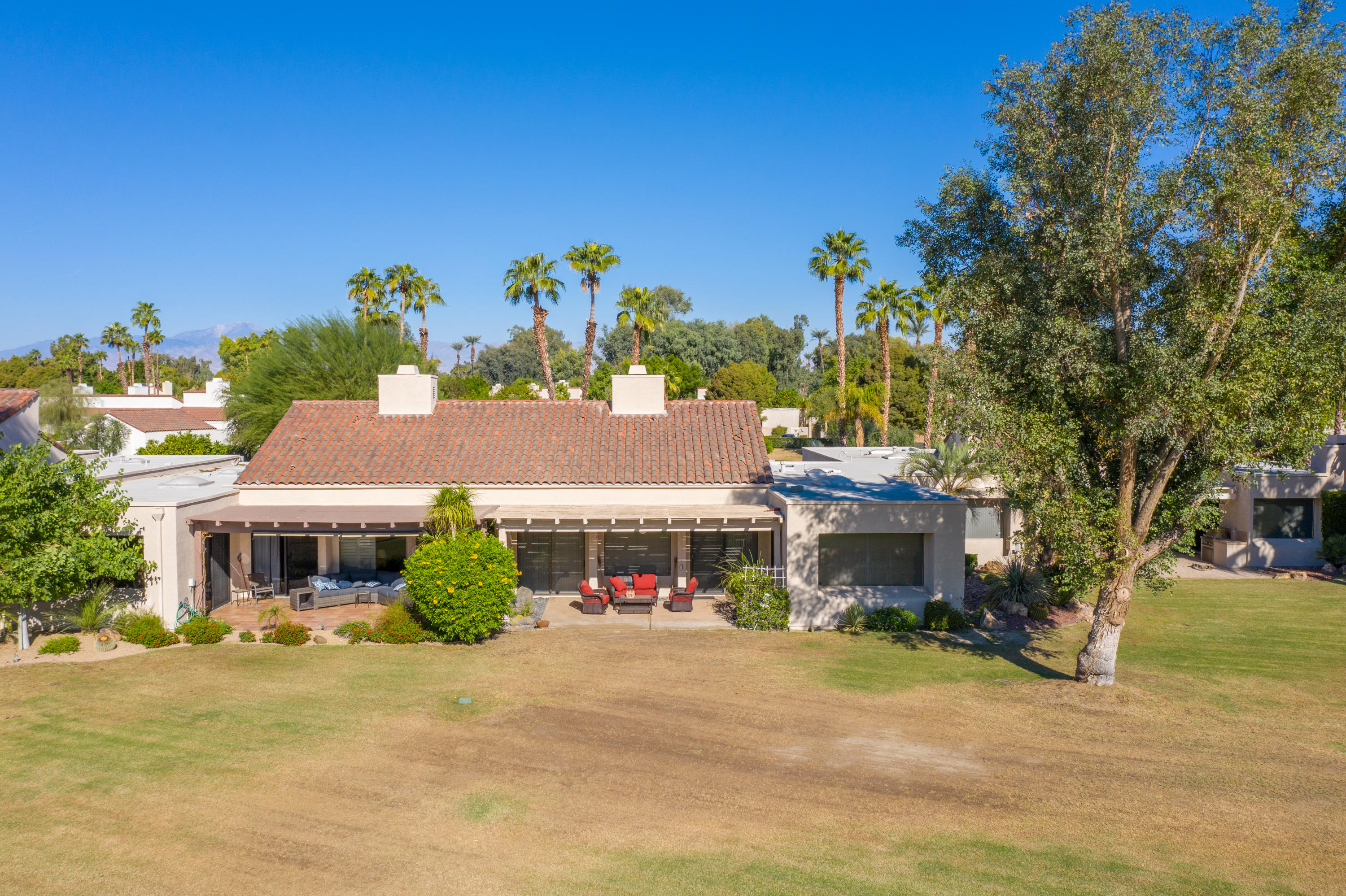 825 Inverness Drive Rancho Mirage, CA 92270 - Photo 33 of 34 a front view of a house with a yard and a garage