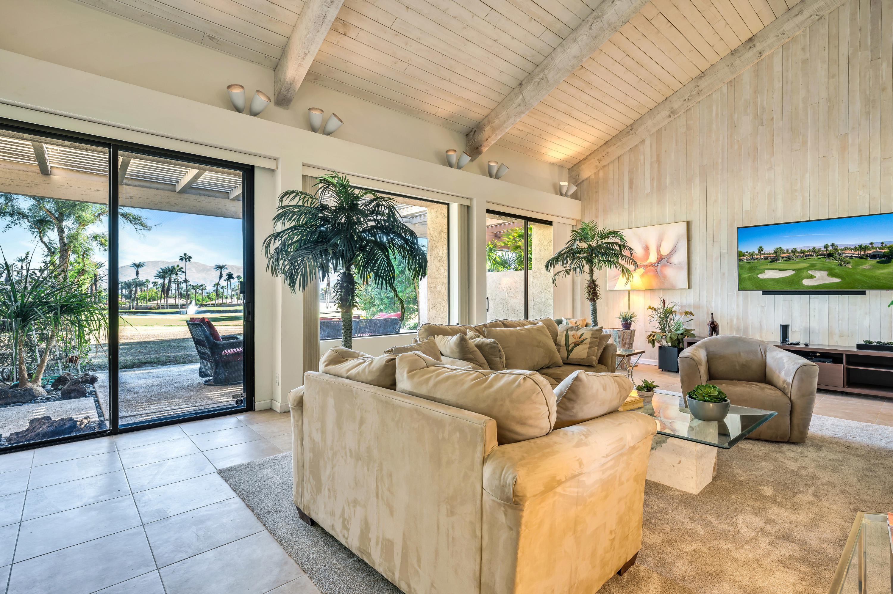 825 Inverness Drive Rancho Mirage, CA 92270 - Photo 5 of 34 a living room with furniture and a large window