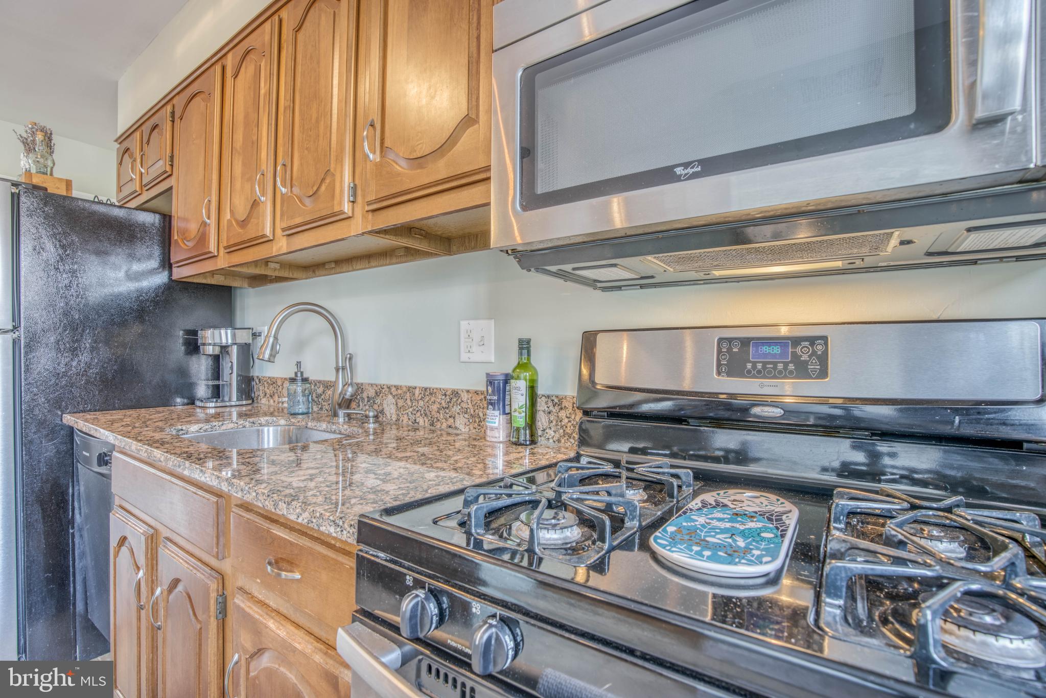 130 Hopkins Road Baltimore, MD 21212 - Photo 19 of 52 a kitchen with a stove a sink and cabinets
