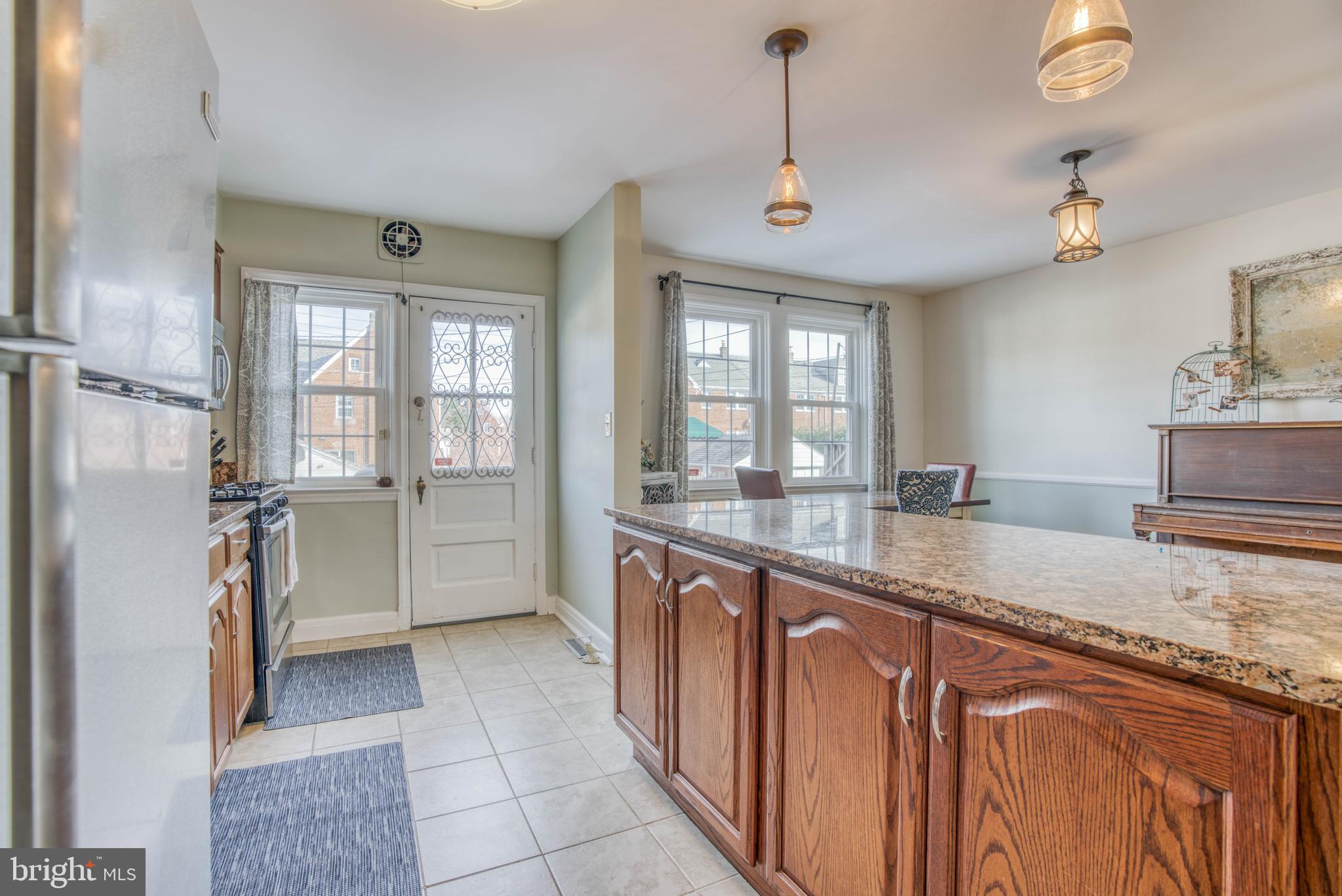 130 Hopkins Road Baltimore, MD 21212 - Photo 22 of 52 a kitchen with stainless steel appliances granite countertop a refrigerator a sink and dishwasher