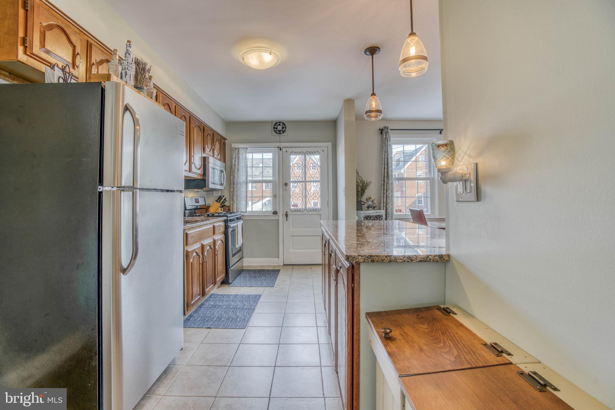 130 Hopkins Road Baltimore, MD 21212 - Photo 23 of 52 a kitchen with stainless steel appliances a refrigerator and a sink