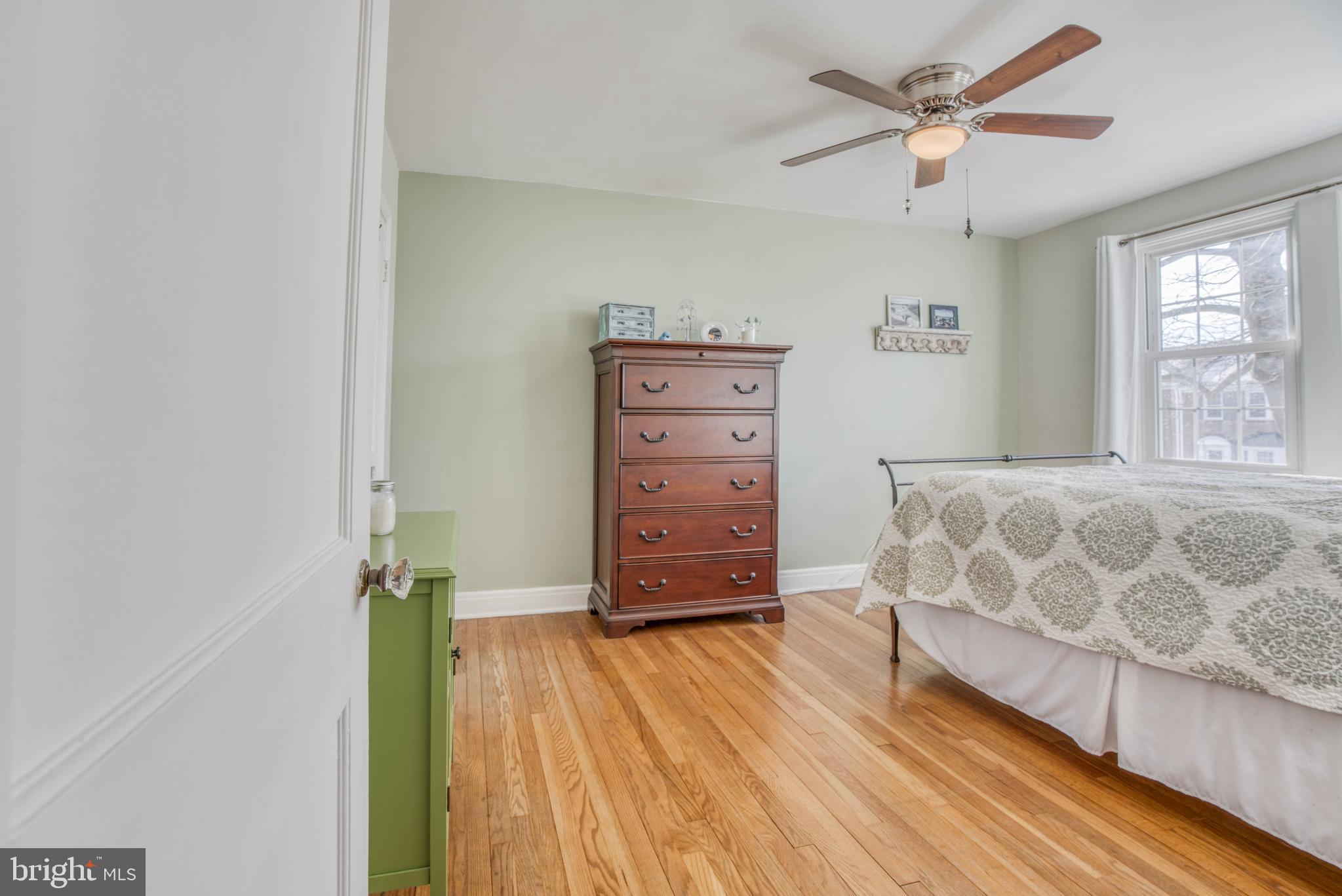 130 Hopkins Road Baltimore, MD 21212 - Photo 24 of 52 a bedroom with a bed and a dresser