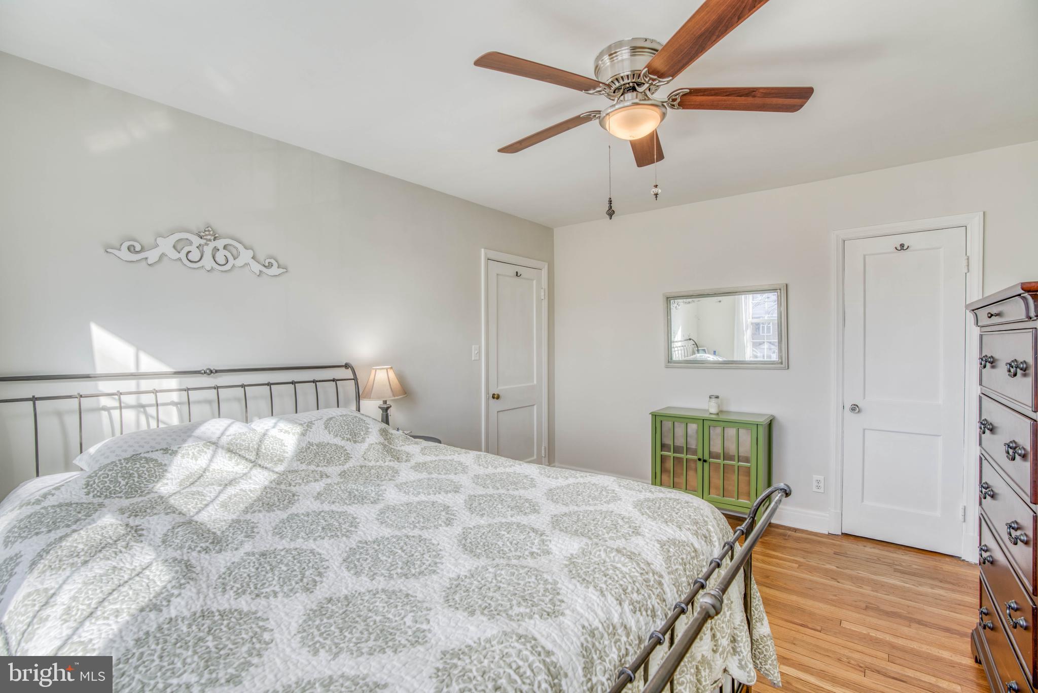 130 Hopkins Road Baltimore, MD 21212 - Photo 26 of 52 a bedroom with a bed and a chandelier