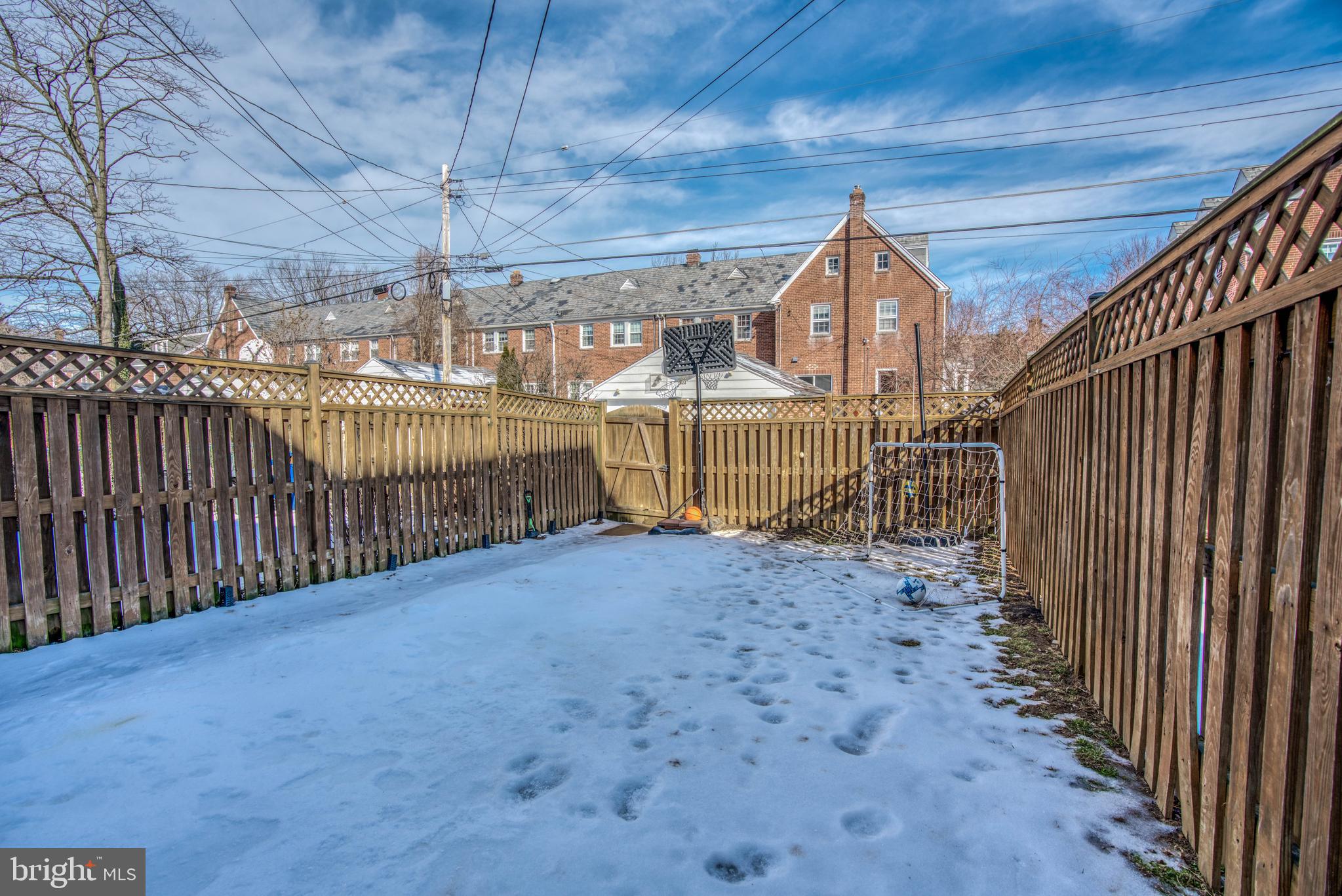 130 Hopkins Road Baltimore, MD 21212 - Photo 48 of 52 a view of a backyard with wooden fence