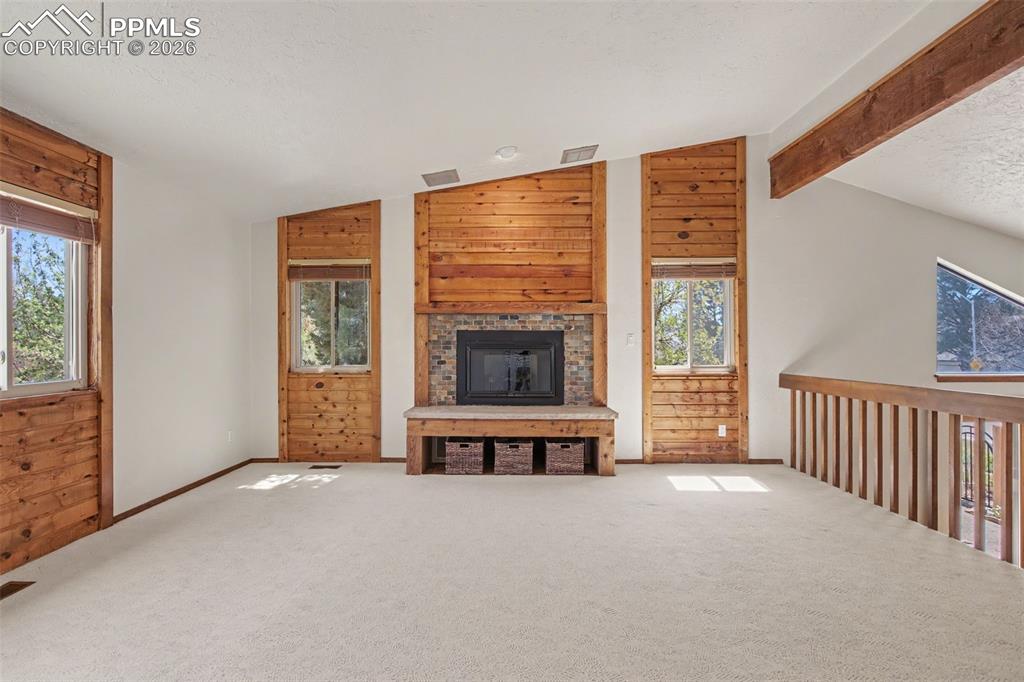 5301 Pinon Valley Road Colorado Springs, CO 80919 - Photo 8 of 27 a view of an empty room with furniture and window
