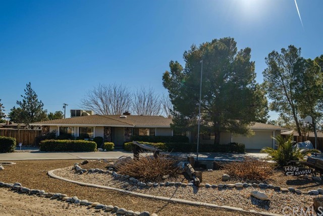 14295 Havasu Road Apple Valley, CA 92307 - Photo 1 of 1 a front view of a house with garden