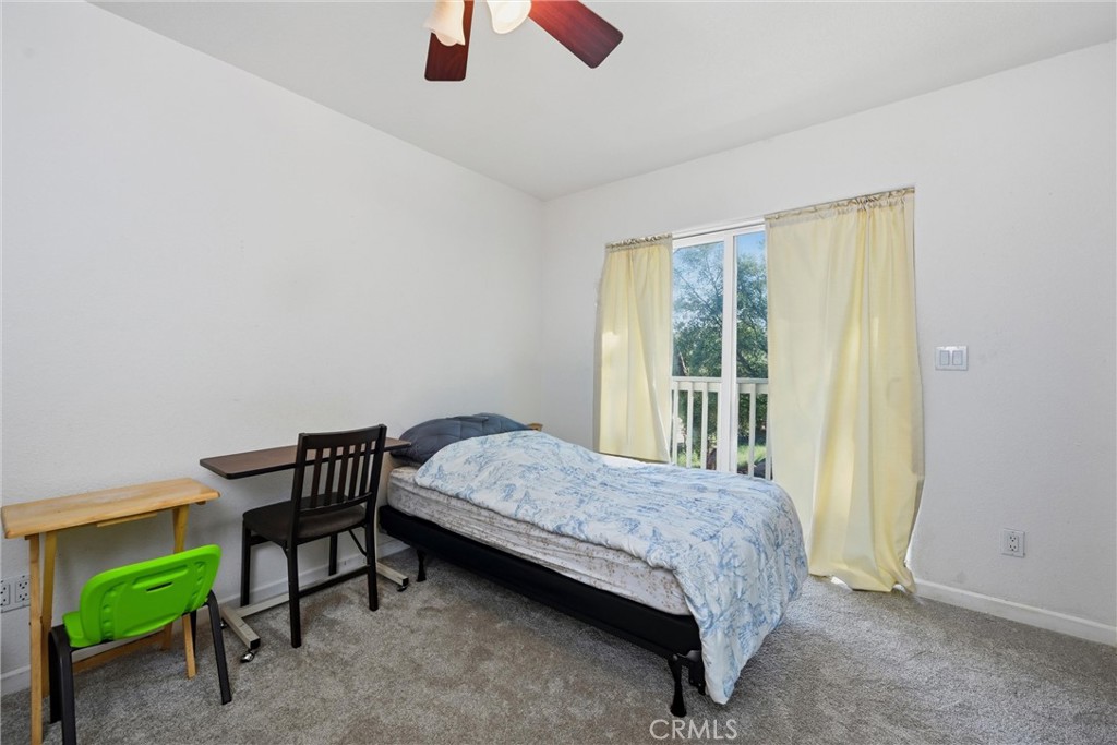 18685 Oak Grove Road Hidden Valley Lake, CA 95467 - Photo 14 of 52 a bedroom with a bed and a window
