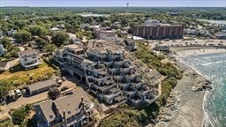 35 Oceanside Drive, Unit 35 Hull, MA 02045 - Photo 16 of 20 a view of a yard with wooden fence