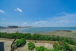 35 Oceanside Drive, Unit 35 Hull, MA 02045 - Photo 18 of 20 a view of a lake from a yard