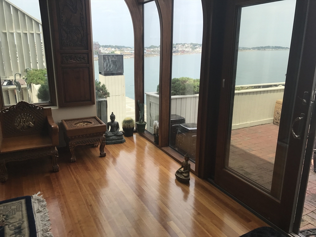 35 Oceanside Drive, Unit 35 Hull, MA 02045 - Photo 5 of 20 a living room with furniture and a large window