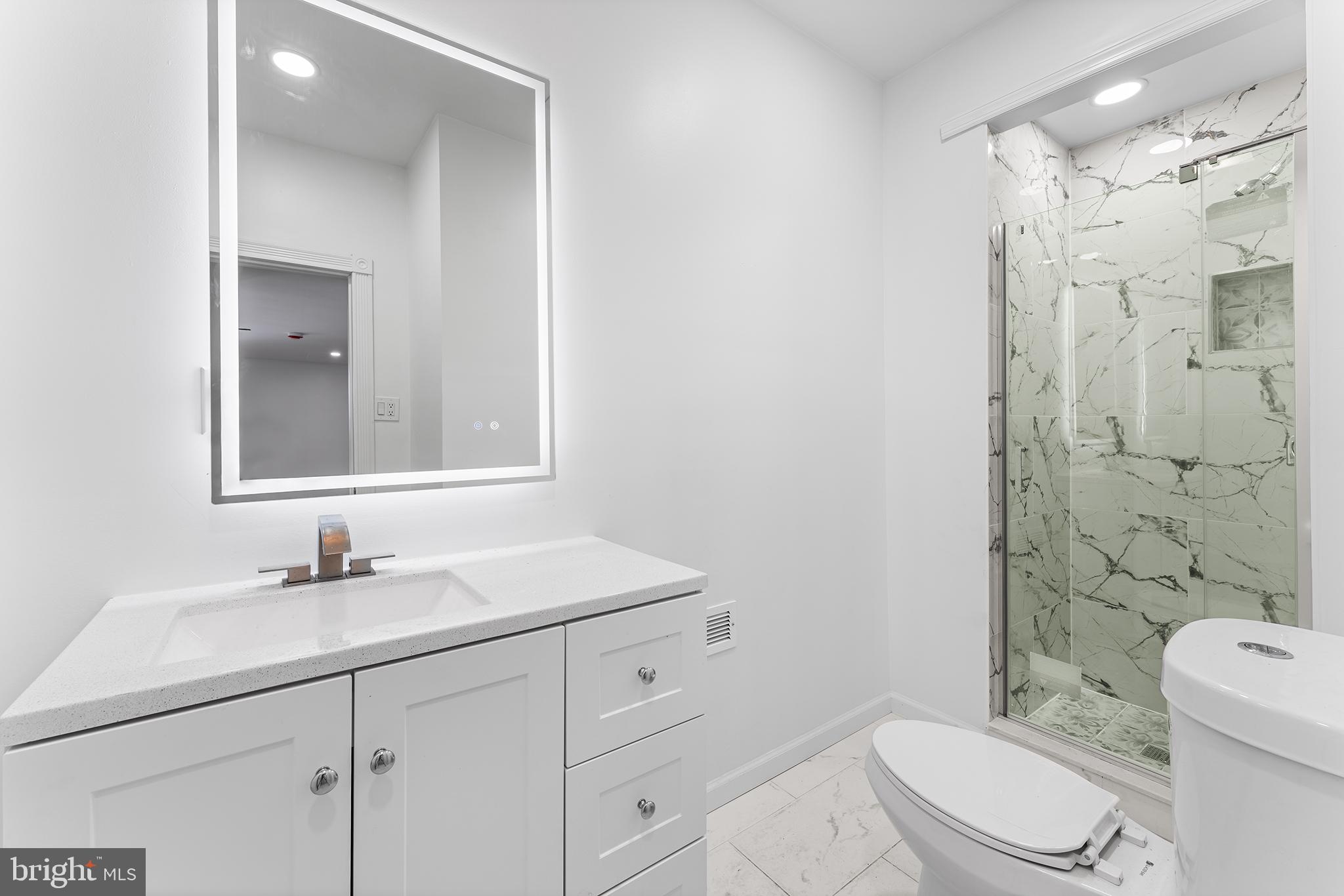 14 Rigel Court Sewell, NJ 08080 - Photo 19 of 40 a bathroom with a sink toilet vanity and shower