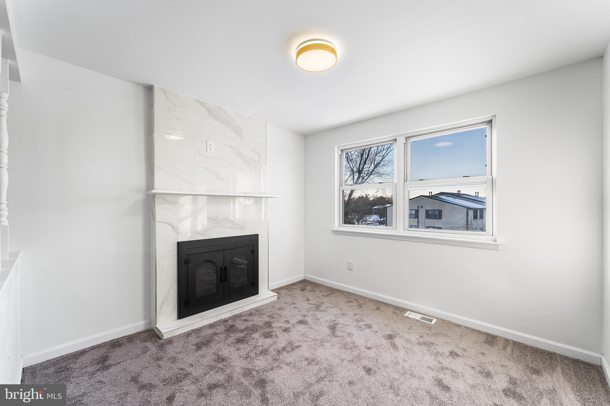 14 Rigel Court Sewell, NJ 08080 - Photo 23 of 40 a view of an empty room with window and fireplace
