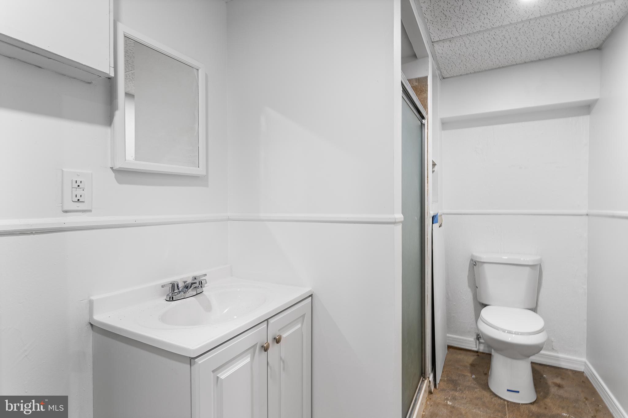 14 Rigel Court Sewell, NJ 08080 - Photo 36 of 40 a white toilet sitting next to a bathroom sink