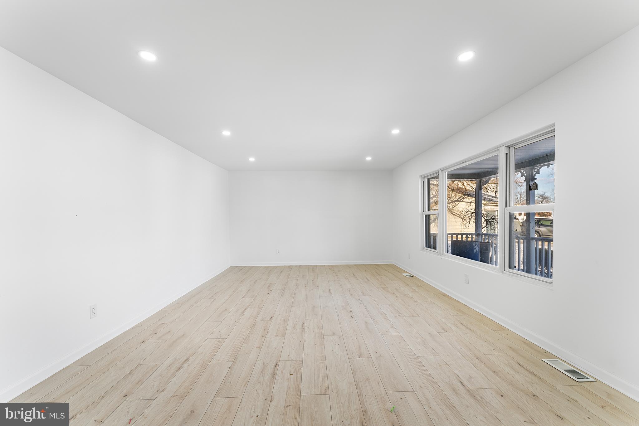 14 Rigel Court Sewell, NJ 08080 - Photo 5 of 40 an empty room with wooden floor and windows