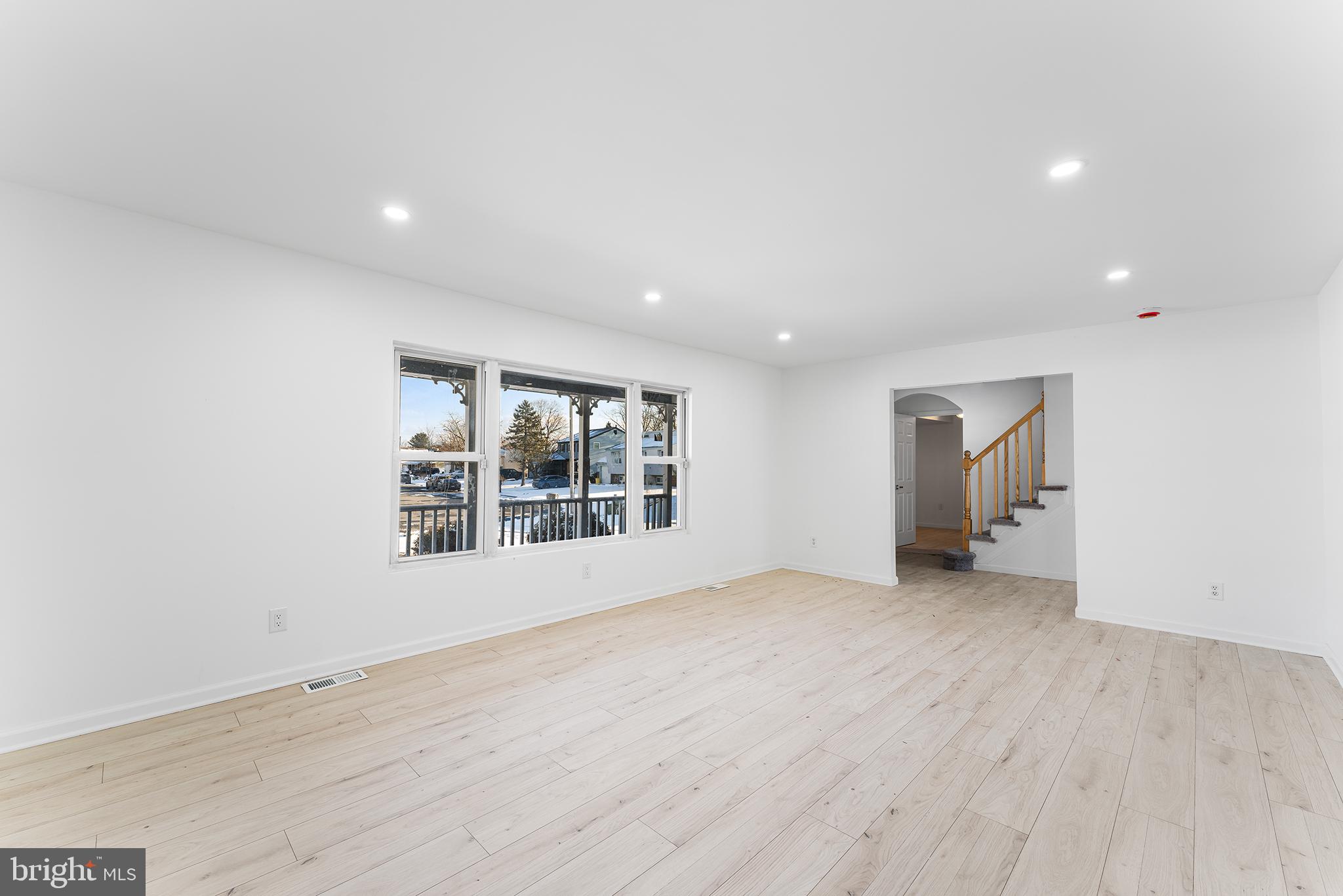 14 Rigel Court Sewell, NJ 08080 - Photo 6 of 40 an empty room with wooden floor and windows