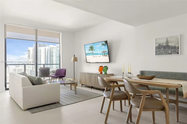 a work room with furniture and a large window