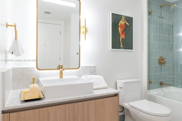 a bathroom with a bathtub and toilet