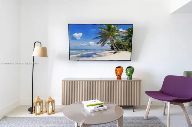 a workspace with furniture and painting on the wall