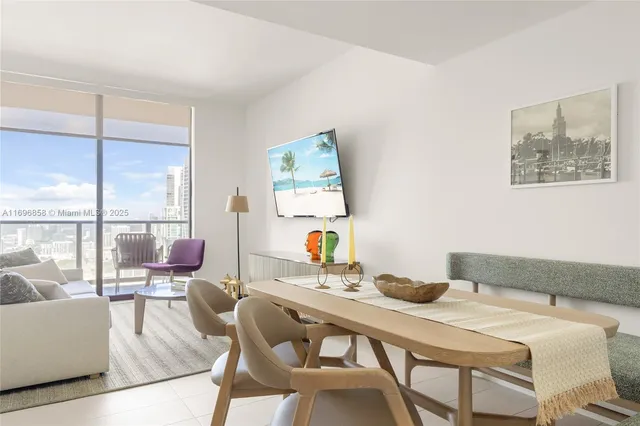 a dining room with furniture and window