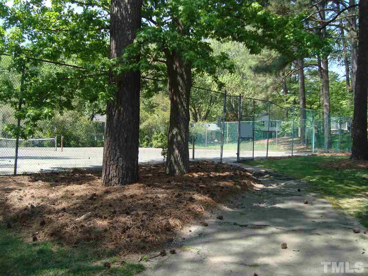 5104 Flint Ridge Place, Unit 5104 Raleigh, NC 27609 - Photo 2 of 12 a view of a yard with a tree