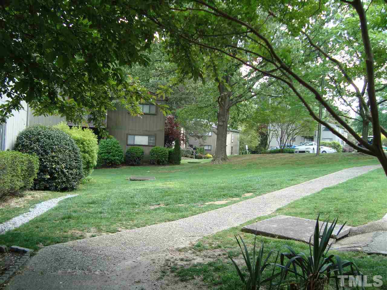 5104 Flint Ridge Place, Unit 5104 Raleigh, NC 27609 - Photo 4 of 12 a view of a backyard with a garden