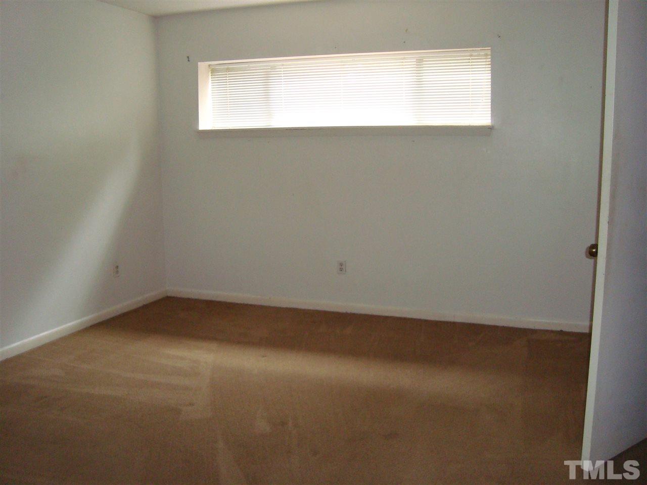 5104 Flint Ridge Place, Unit 5104 Raleigh, NC 27609 - Photo 7 of 12 an empty room with a window