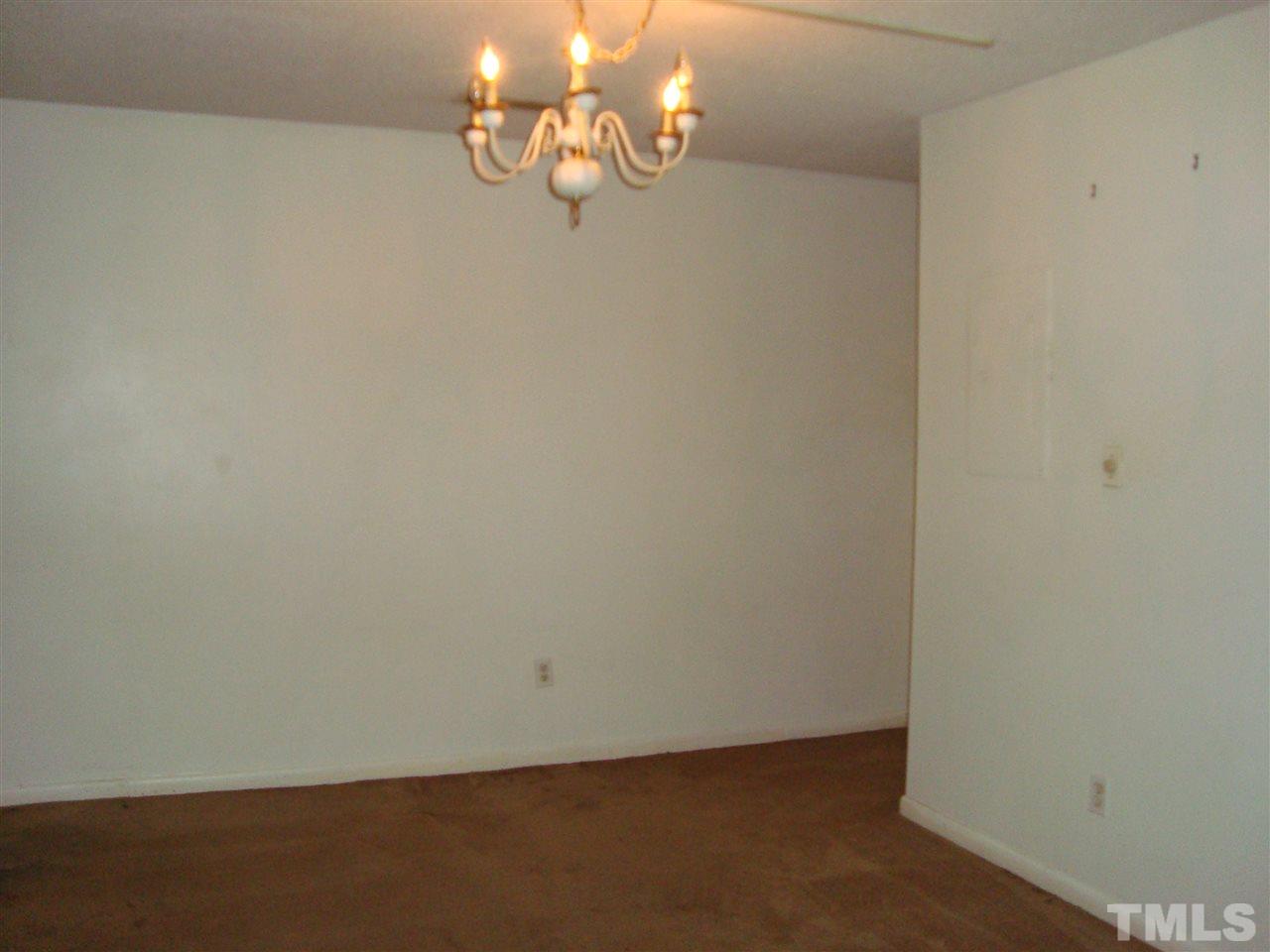 5104 Flint Ridge Place, Unit 5104 Raleigh, NC 27609 - Photo 9 of 12 en empty room with wooden floor