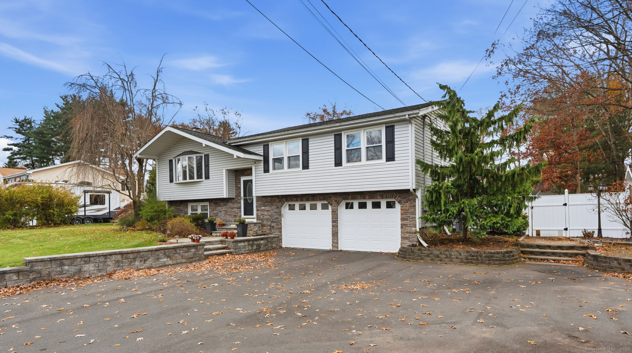 484 Jude Lane Southington, CT 06489 - Photo 2 of 40 a front view of a house with a yard and garage