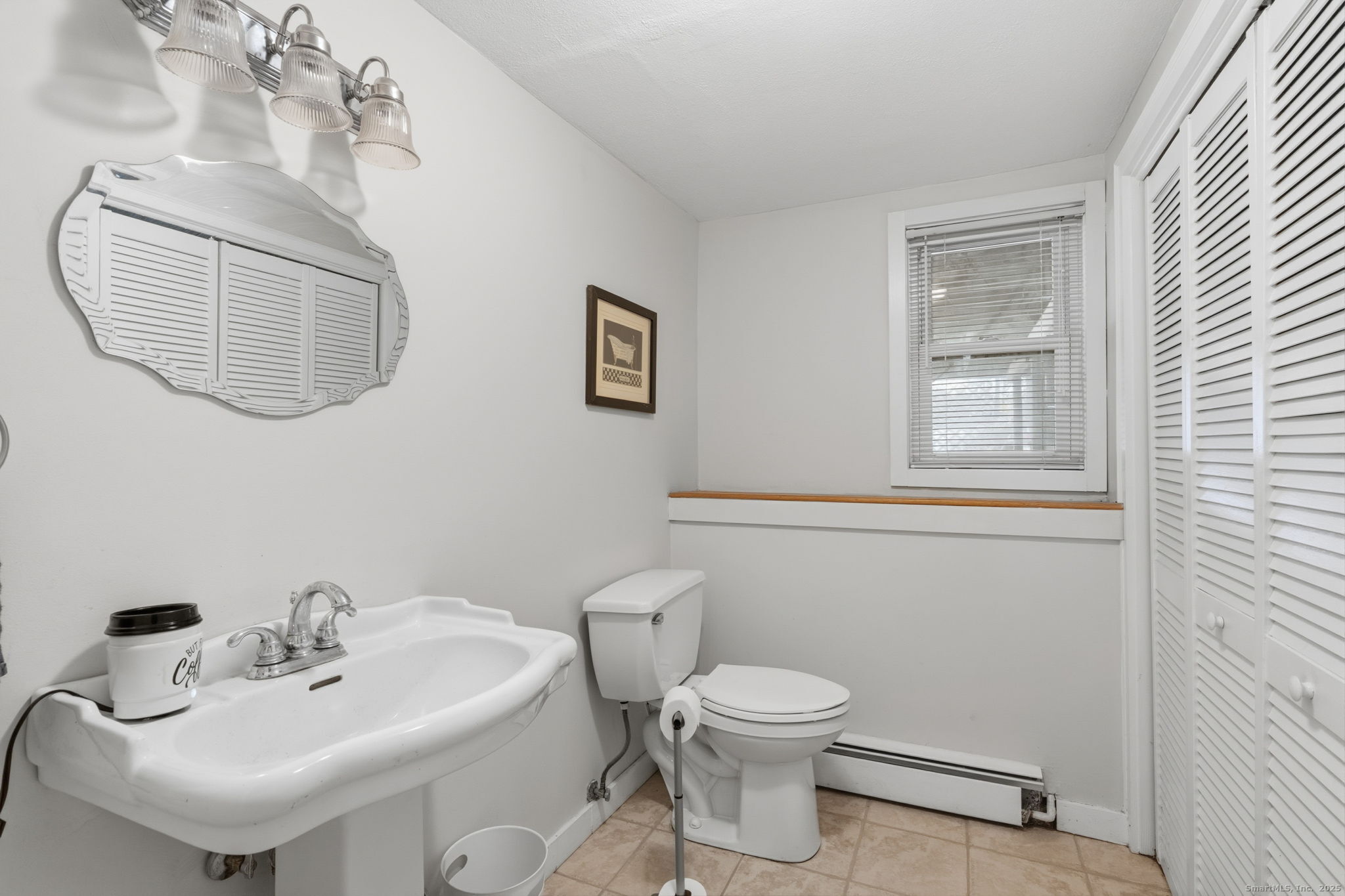 484 Jude Lane Southington, CT 06489 - Photo 26 of 40 a bathroom with a toilet a sink and mirror