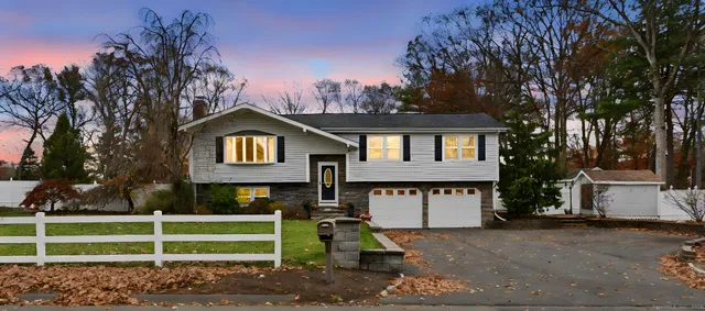 an aerial view of a house with a garden and swimming pool