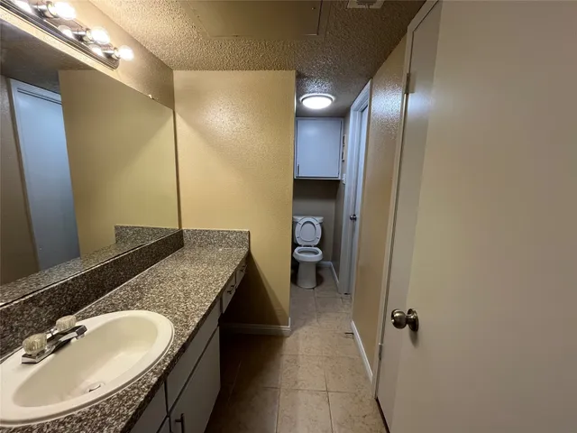 a bathroom with a sink double vanity and a mirror