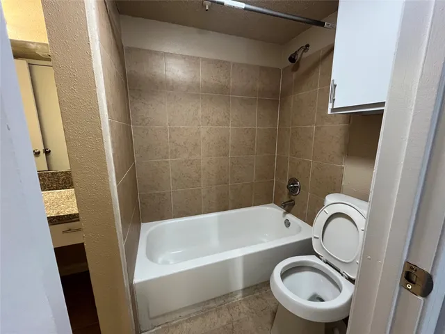 a bathroom with a sink a bathtub and a shower