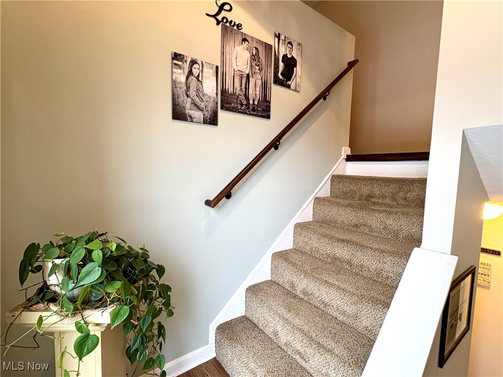4015 Marks Road, Unit 3C Medina, OH 44256 - Photo 19 of 36 Stairway featuring hardwood / wood-style flooring