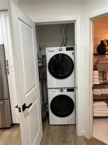 a view of a hallway with washer and dryer