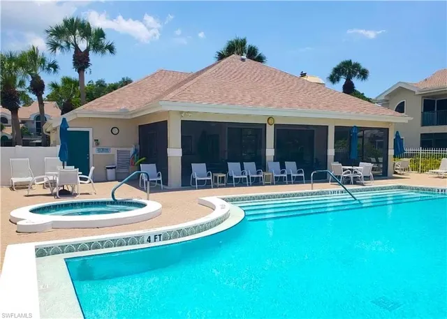 a small pool with some trees in the background
