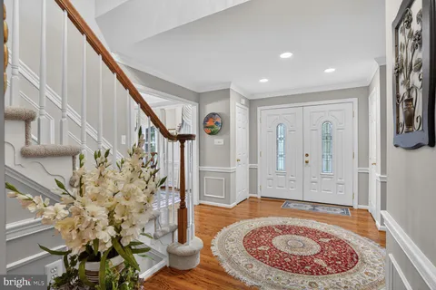a view of an entryway with wooden floor
