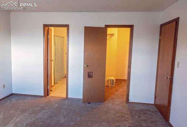 20 Sommerlyn Road Colorado Springs, CO 80906 - Photo 46 of 50 21 El Sereno Dr: Primary Bedroom Suite with Walk-In Closet