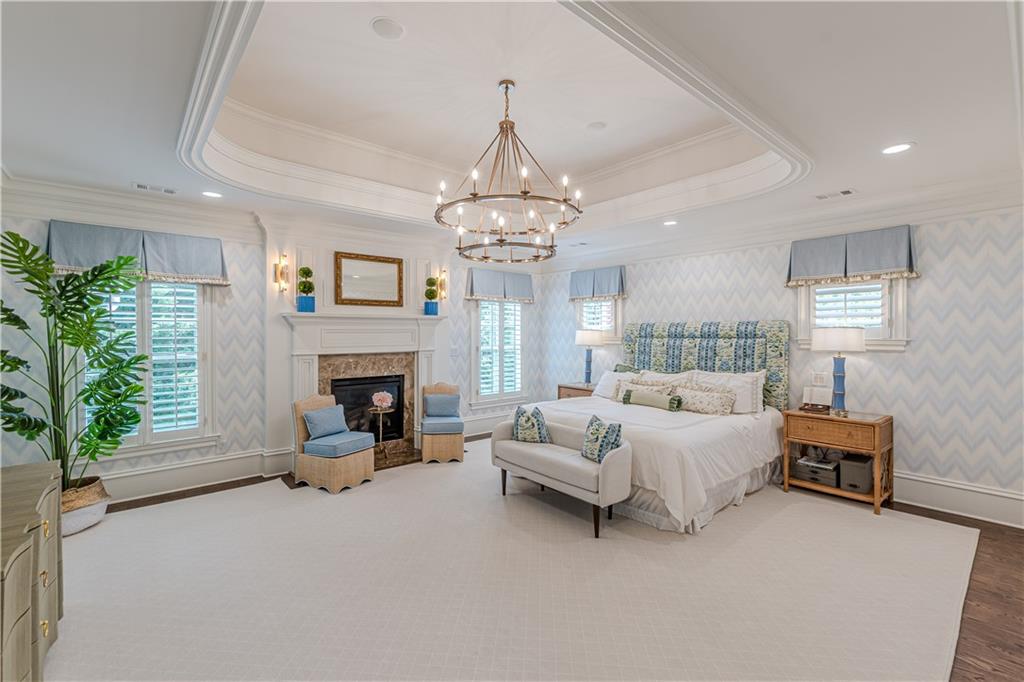 2010 Caladium Way Roswell, GA 30075 - Photo 28 of 71 a spacious bedroom with a bed and a chandelier