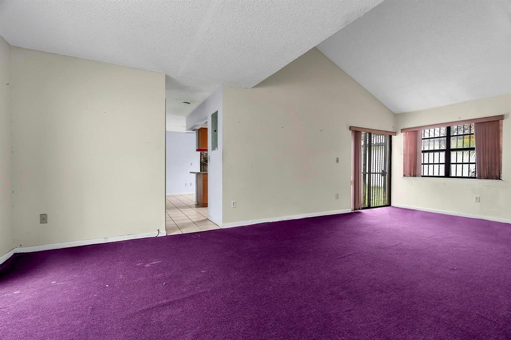 602 Southwest 99th Place Miami, FL 33174 - Photo 11 of 42 an empty room with windows