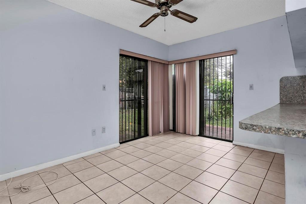 602 Southwest 99th Place Miami, FL 33174 - Photo 16 of 42 a view of a room with a projector and window