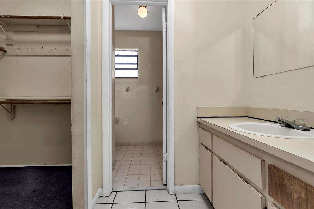 602 Southwest 99th Place Miami, FL 33174 - Photo 24 of 42 a utility room with cabinets washer and dryer